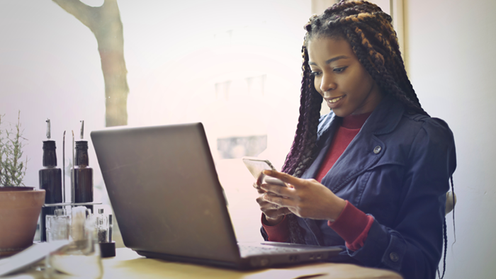 “woman researching metadata management from her laptop”