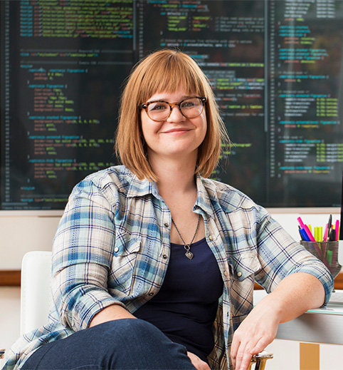 Business person sitting at their desk | Informatica